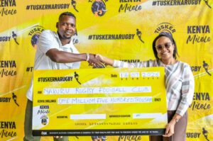Sarah Kiritu (R) – Senior Shopper Manager at KBL presents a KES 1.5 million sponsorship dummy cheque to Edward Moseti – Prinsloo Sevens Tournament Director.